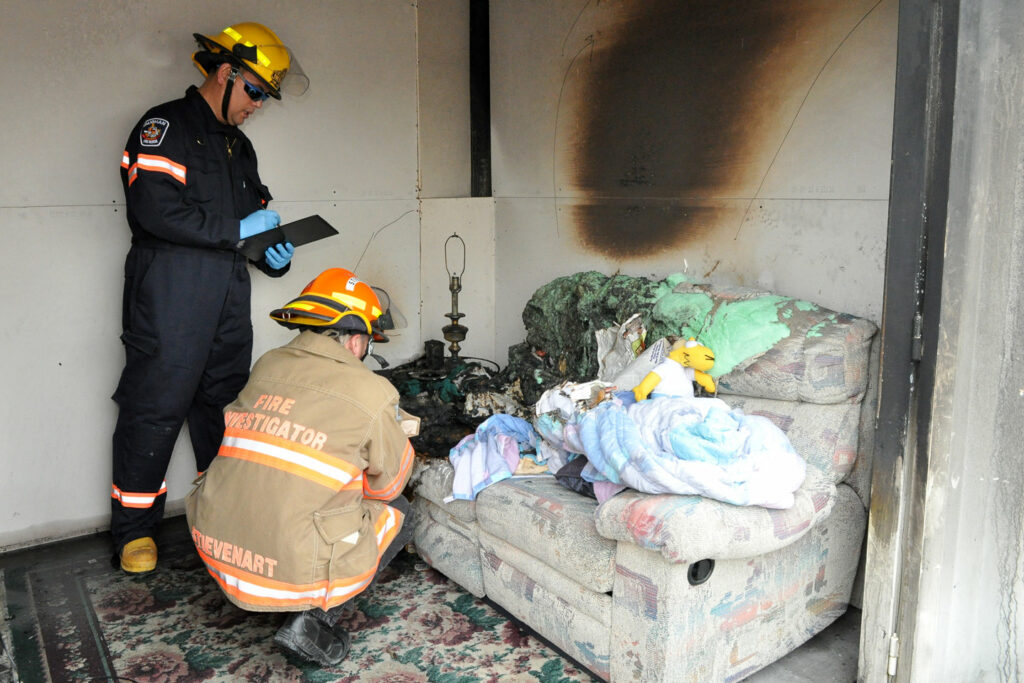 Festi Firefighters Inspecting House Fire